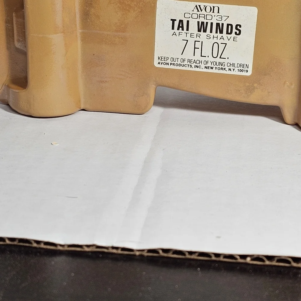 Avon Cord 37 Car Bottle. Tan Tai Winds After Shave Bottle